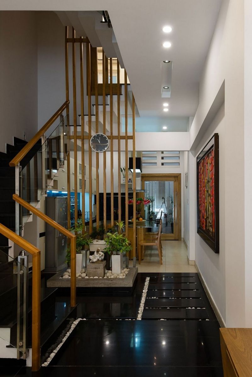 Description: Small indoor garden feature with a light well above creates a refreshing ambiance indoors Nhà phố Sài Gòn với thiết kế giải quyết vấn đề về diện tích qpdesign